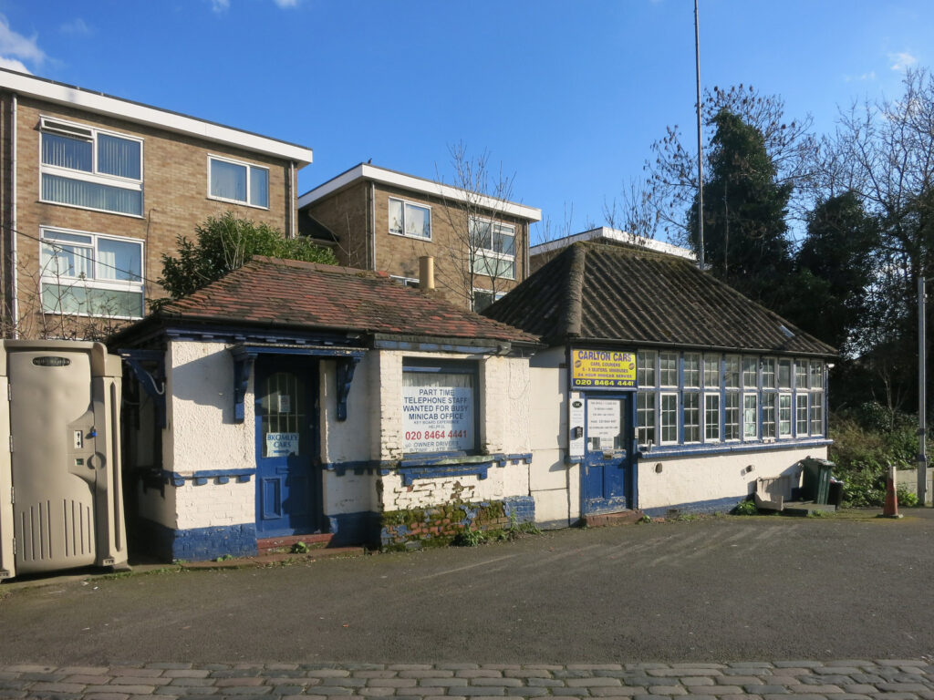 Small blue and white commercial building with residential apartments above, Irish street scene