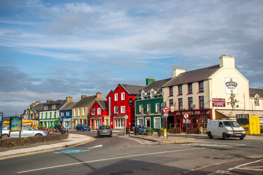 Colorful row of buildings on Irish village street with shops and pub