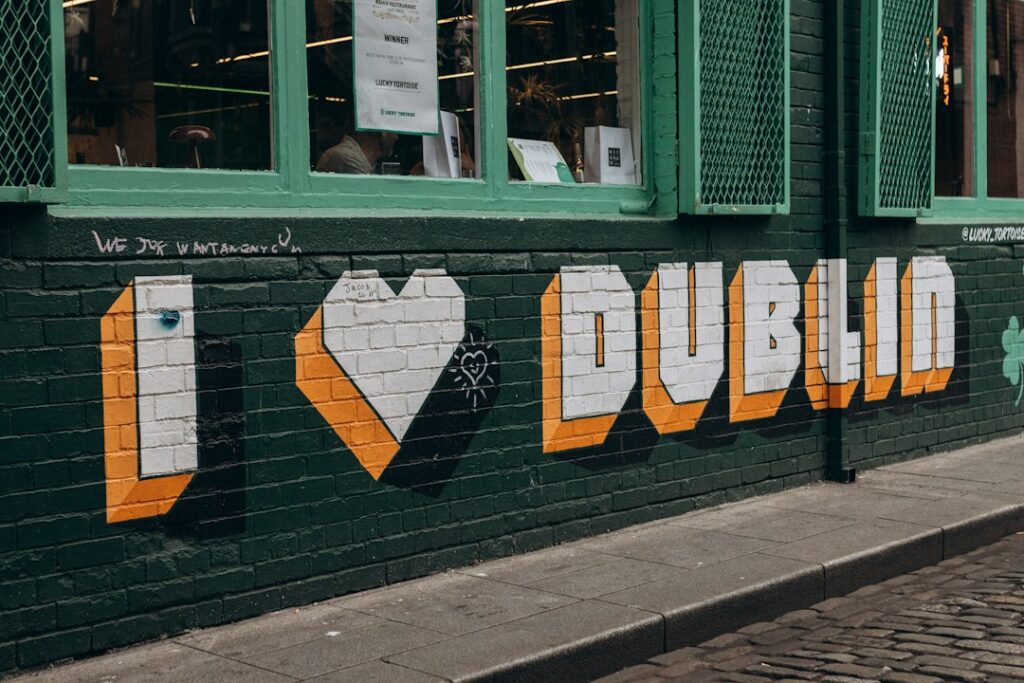 I love dublin graffiti on a green brick wall