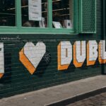 I love dublin graffiti on a green brick wall